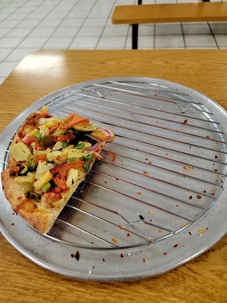 Pizza Almost Devoured and the Bottom Crust Still Very Crispy